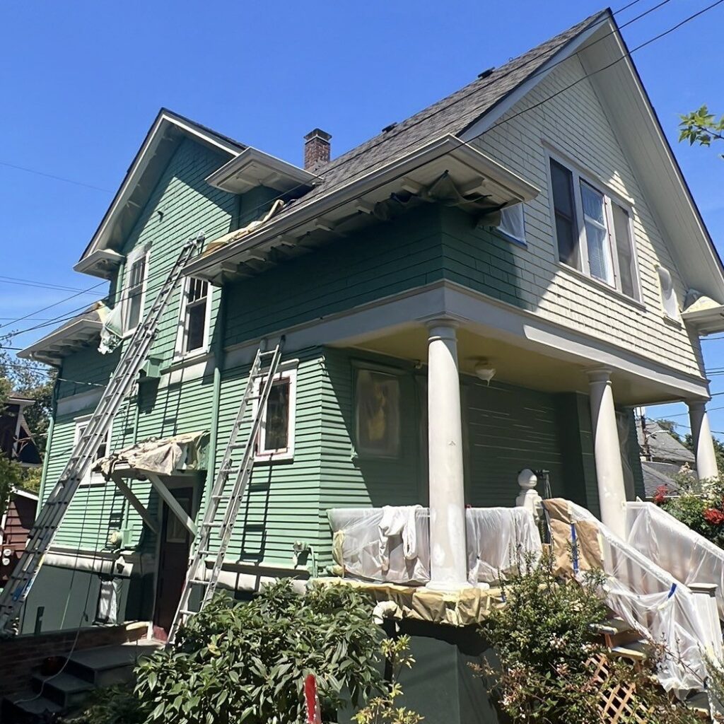 Process of painting the house on the front.