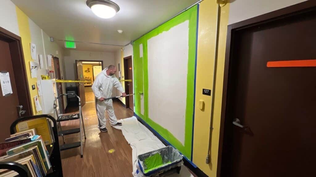 Sound Painting Solutions painting a TikTok wall for Mary's Place Seattle