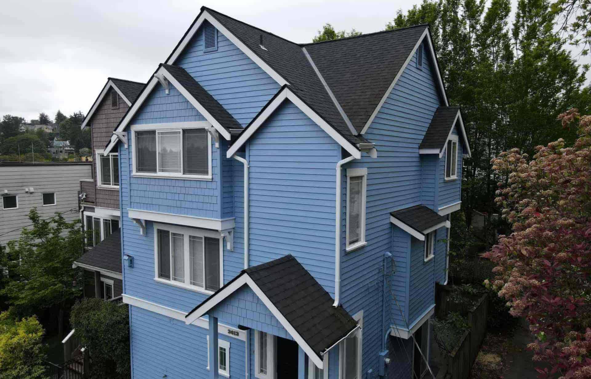 A vibrant blue exterior painting job in Seattle completed by Sound Painting Solutions